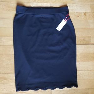 Scalloped pull on black skirt